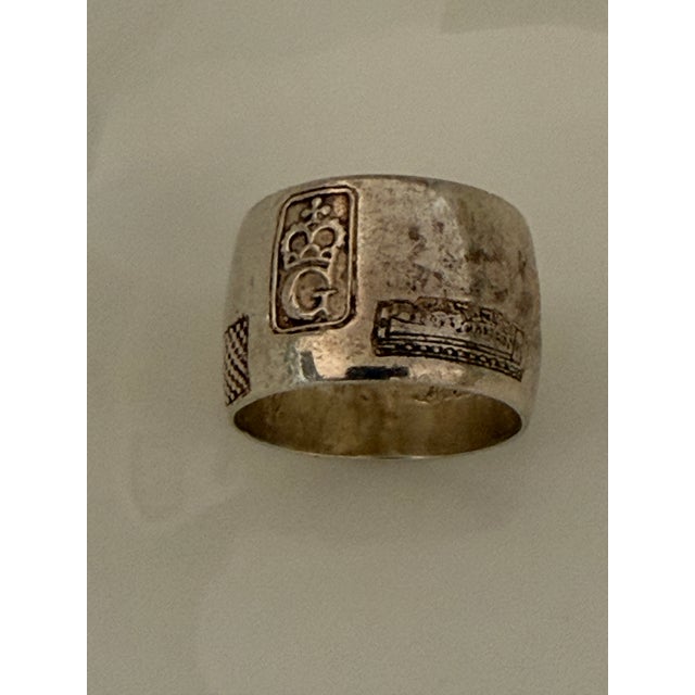 Multiple ornamental figures engraved along the exterior of the ring “TURKEY” letters are engraved inside the ring Vintage...