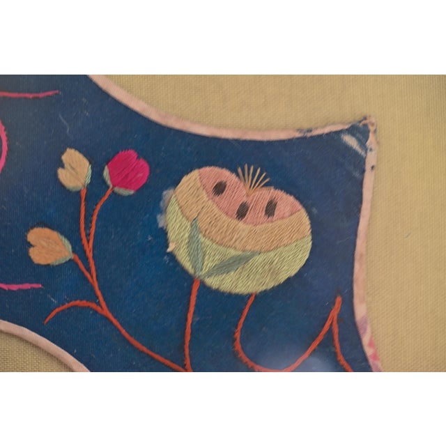 This Chinese embroidered silk child’s collar was used for festivals. This collar has scalloped edges and features peaches....