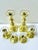 A substantial set of six Baldwin brass candlesticks featuring classic turned silhouettes and removable glass bobeches to...