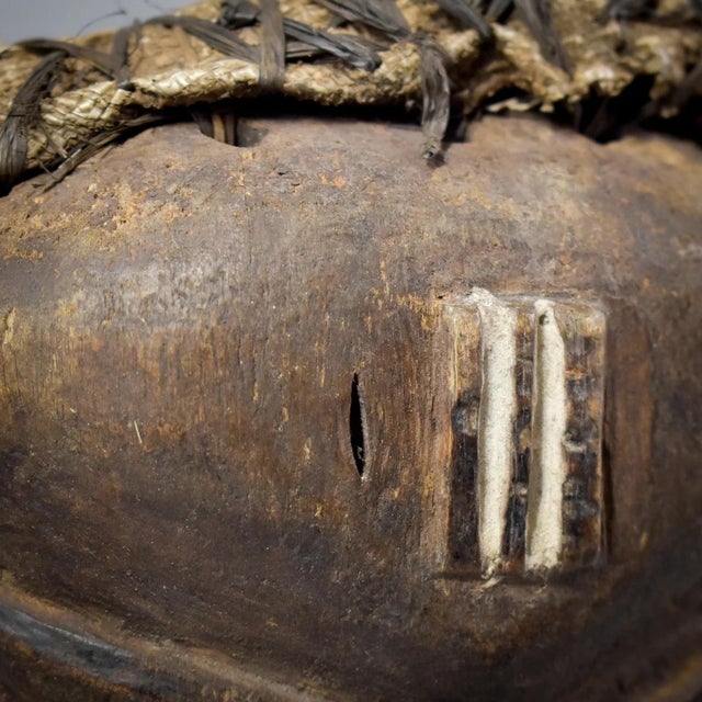 This authentic hand-carved mask from the Pende people of the Congo features a distinctively crafted beard and a finely...