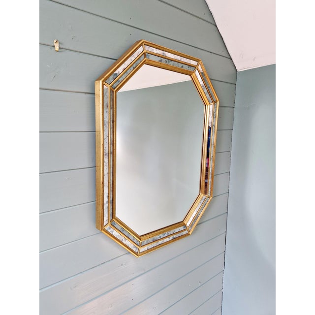 Octagonal giltwood mirror with frame, Hollywood Regency style, produced by the Belgian manufacturer Deknudt in the 1970s....