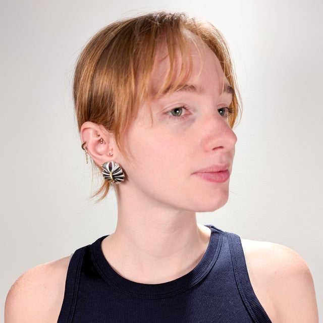 A fine pair of Danish Modern silver & gold clip-on earrings. In sterling silver & 18 karat yellow gold. Designed by Lene...