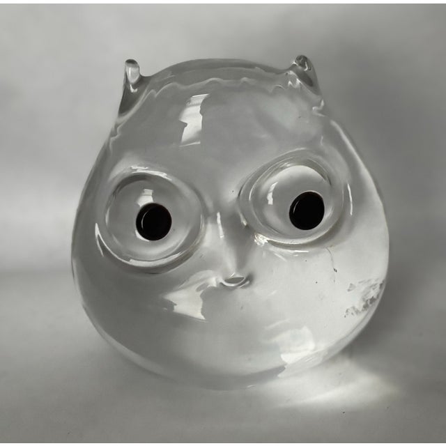 A wonderfully expressive Italian art glass owl sculpture or paperweight, formed from a substantial mass of clear glass...