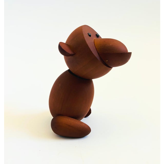 A mid century turned wood figurine in the shape of a monkey. Adorable stylized features. Made in Japan by Senshukai as...