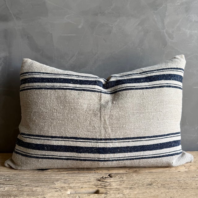 18" x 26" Includes Insert Color: Flax / Natural / Navy / White A truly one-of-a-kind pillow, thoughtfully handcrafted from...