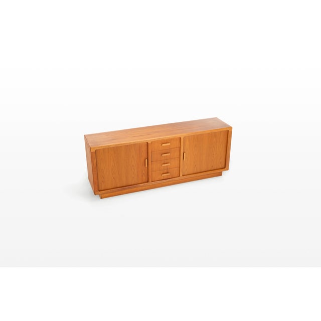 Danish vintage sideboard designed in the 1960s in denmark by cfc silkeborg denmark. Teak version with tambour doors, five...