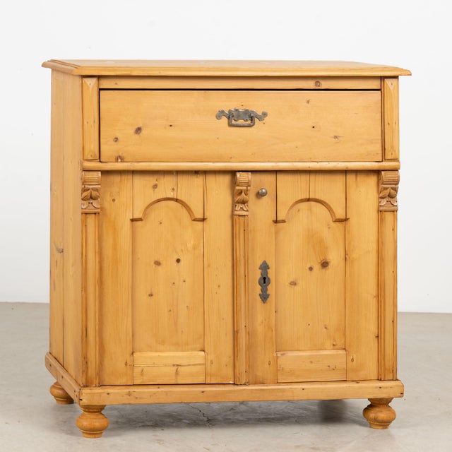 19th century Danish sideboard, crafted in pine with a warm wax finish that highlights the natural color and character of...
