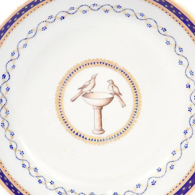 A fine late 18th or early 19th Century Chinese export armorial porcelain saucer. With a white ground and cobalt blue and...
