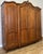 This elegant Vintage French Louis wardrobe presents timeless sophistication with beautifully carved decorative panels, a...