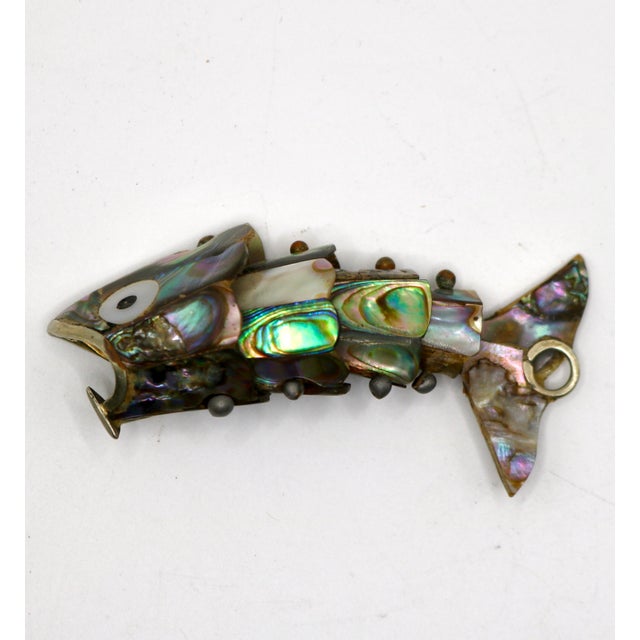 A rare and enchanting miniature find! This mid-century Mexican articulated fish pocket tool/bottle opener scales down the...