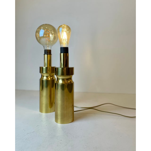 Set of two cylindrical brass table lamps from the late 1970’s, early 1980’s. - Produced by: unknown Sourced in: Italy...
