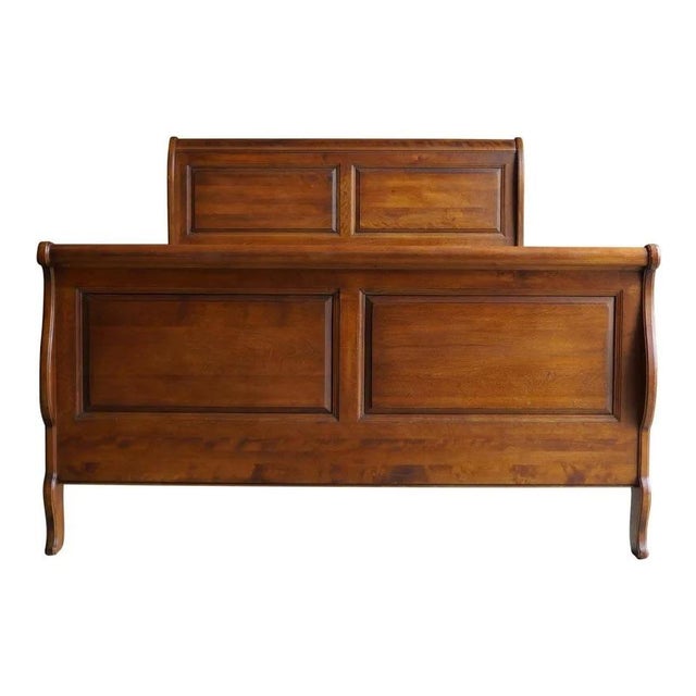 This Ethan Allen Attributed French Country Sleigh King Bed features classic European-inspired styling with elegant curves...