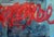 Vivid red loops pulse across layered blues, teals and navy, with a delicate web of blue lines in the lower right. The red...