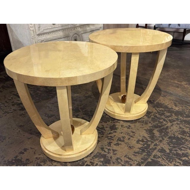 This product is a pair of Italian Art Deco style creme colored lacquered parchment tables. The tables are very unique ,...