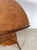 This mid century accent table features hardwood construction, two tier design, and turned wood legs in a bamboo style.