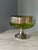 This highly unusual vintage/antique bowl is a beautiful shade of green glass with a pierced silver plate overlay and...
