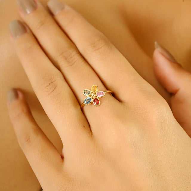 Add a joyful burst of color to your summer wardrobe with this enchanting 14K Yellow Gold Rainbow Sapphire Flower Ring....