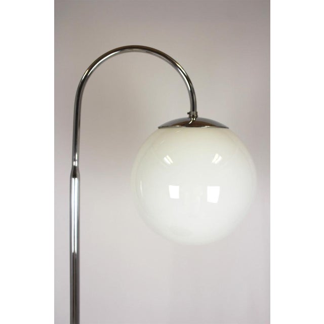 This Bauhaus floor lamp was manufactured in the Czech Republic in the 1940s. The lamp is preserved in its original, very...
