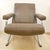 Lounge armchair with taupe/olive skai upholstery and chrome-plated steel legs in an X-shaped base design in the style of...