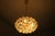 Kinkeldey chandelier in gold plated brass from the 1960s with faceted glass crystals cut in octagonal shapes hanging from...