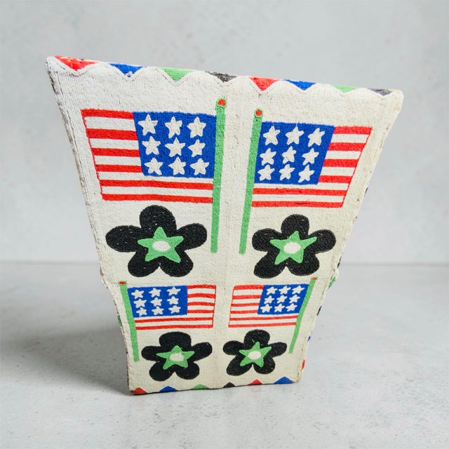 Vintage Nigerian Yoruba style hand-beaded armchair featuring American flags, floral motifs, and geometric designs....