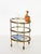 Gorgeous tiny Mid-Century serving bar cart in solid brass and crystal glas. Maison Jansen produced this stylish serving...