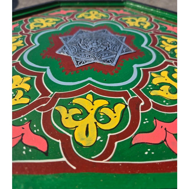 Bring the beauty of traditional Moroccan craftsmanship into your home with this stunning hand-painted wooden side table....