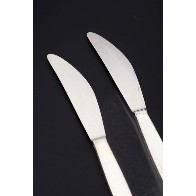 Georg Jensen, two lunch knives, Cypress. Two lunch knives in stainless steel and sterling silver in the Cypress model from...