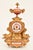 An exquisite French three-piece clock garniture crafted during the mid to late 19th century, beautifully combining richly...