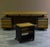 Important large desk with beech wood top and black painted metal uprights. Large side drawers with lock. The set also...