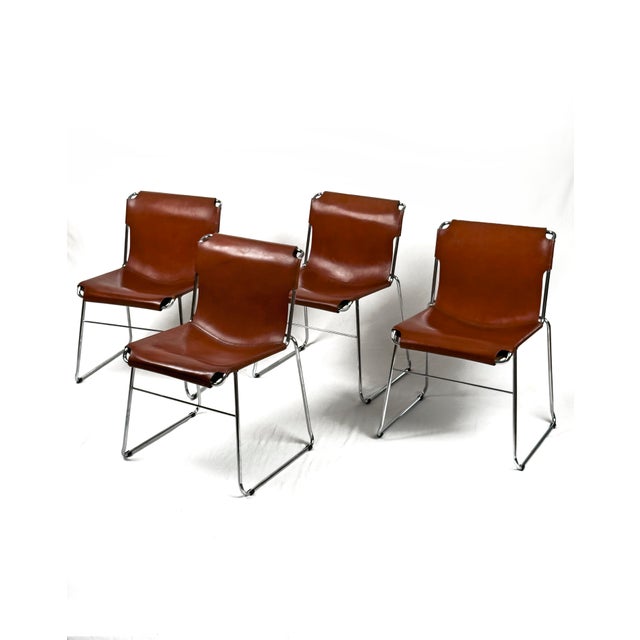 A rare pair of Italian chairs from the 1970s, featuring tubular chrome frames and one-piece leather slings. The design is...