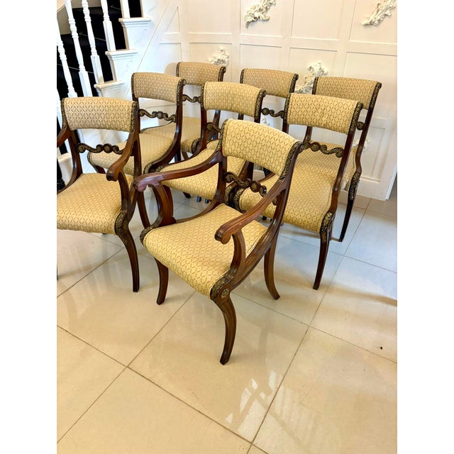 Exhibition quality set of eight antique Regency mahogany dining chairs consisting of a pair of elbow chairs and six single...