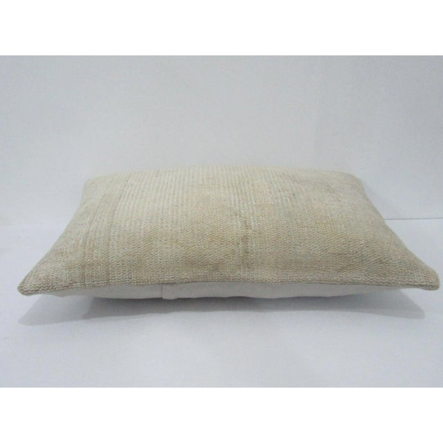 Decorative pillow cover made from a vintage Turkish handknotted rug. Backed with good quality cotton fabric. Pillow...