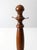 This is an antique display stand. The turned wood countertop stand features three small metal nail hooks for hanging...