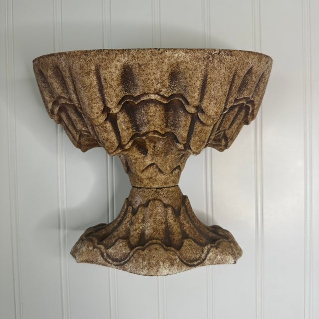 Originally made as a cast iron stove urn, or humidifier, designed to hold water near the heat of a parlor stove so it...