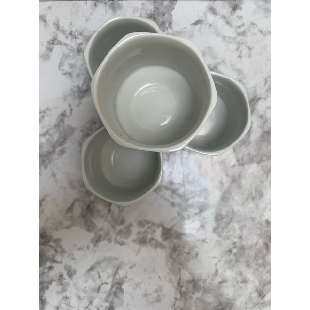 Sweet set of four blue and white pottery ceramic Asian chinoiserie cups with cherry blossom motif. Japanese classic style....