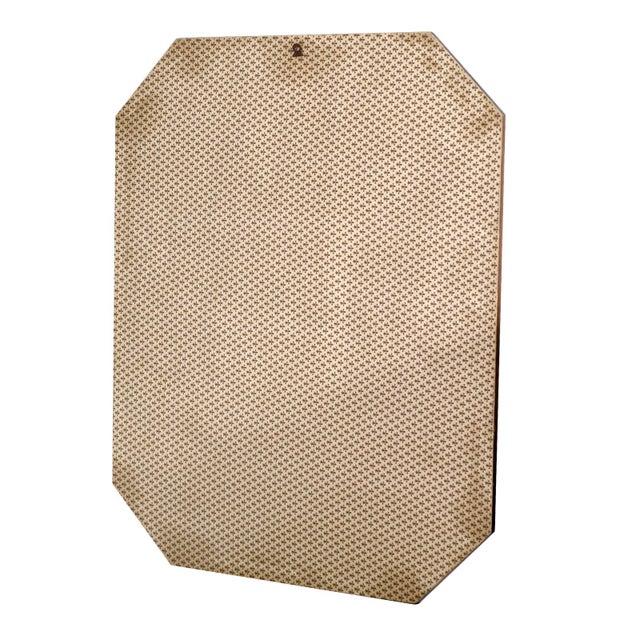 A refined italian wall mirror distinguished by its elegant octagonal silhouette and beautifully crafted veneered frame....