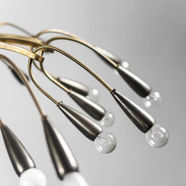 24-light chandelier from the 1950s. Brass frame. Good condition, signs of time present. 1950s design Up to 250V (Europe/UK...