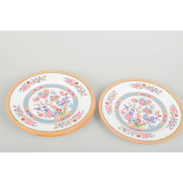 Cauldon China, England Plates, mid-20th century. Set of four faience plates with colourful orientalist floral decoration...