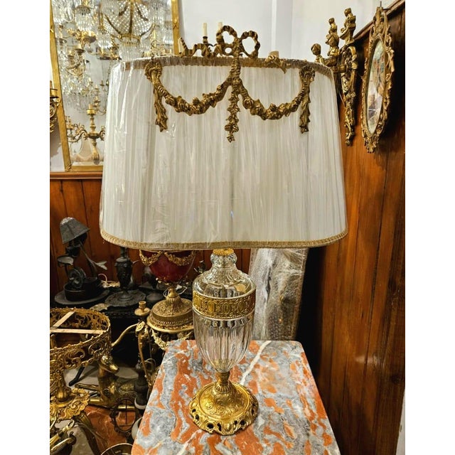 Bring timeless European elegance into your home with this exquisite French Empire-style table lamp. Featuring a...