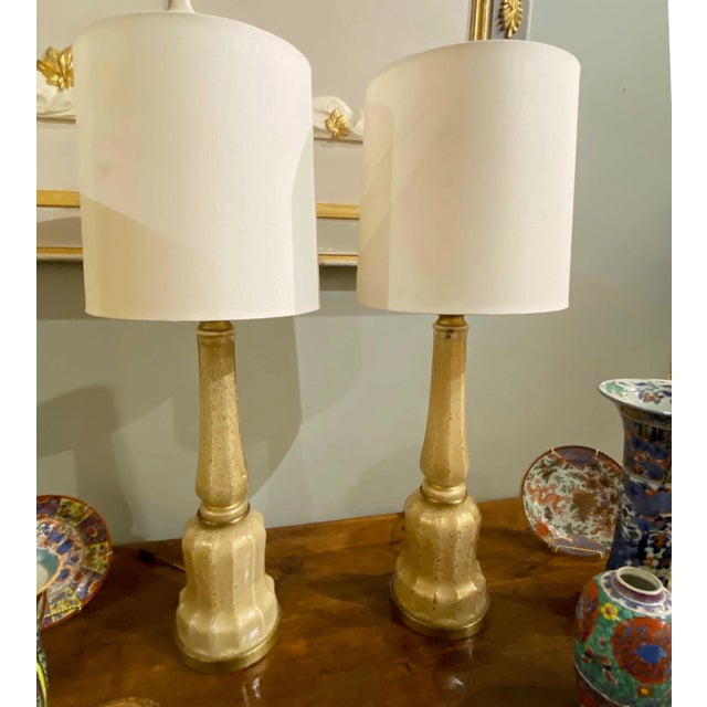 Pair of 1960’s golden glass lamps by Maison Bagues, French origin. Lamps are 6.5” Diameter x 34” High the Shades are 11”...