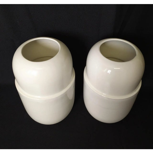 This vases have been produced in the 1990. Marked "Munari" under the vases. In the part below, refined watercolor striped...