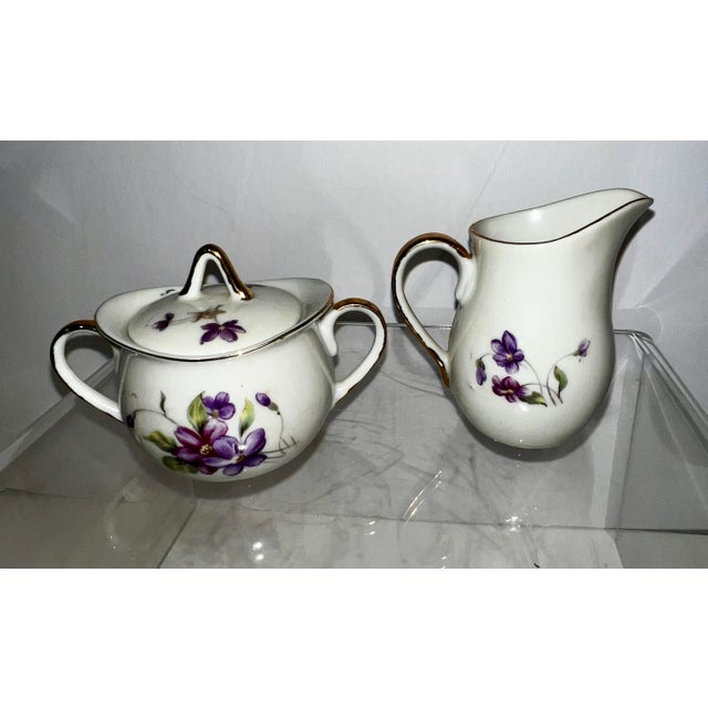 Beautiful demi size cream and sugar set by Royal Sealy... Has original sticker. No chips or flaws. Embellished with gold...