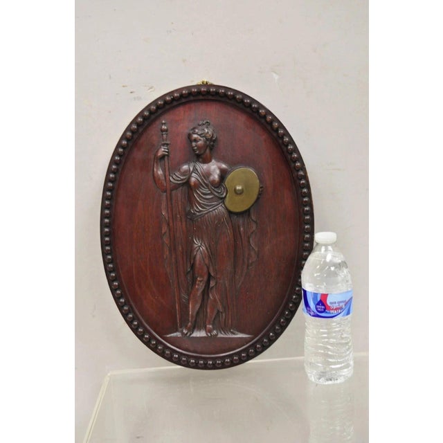 Antique Classical Oval Carved Mahogany Figural Goddess Wall Sculpture Plaque. Circa Early 20th Century. Measurements: 16"...