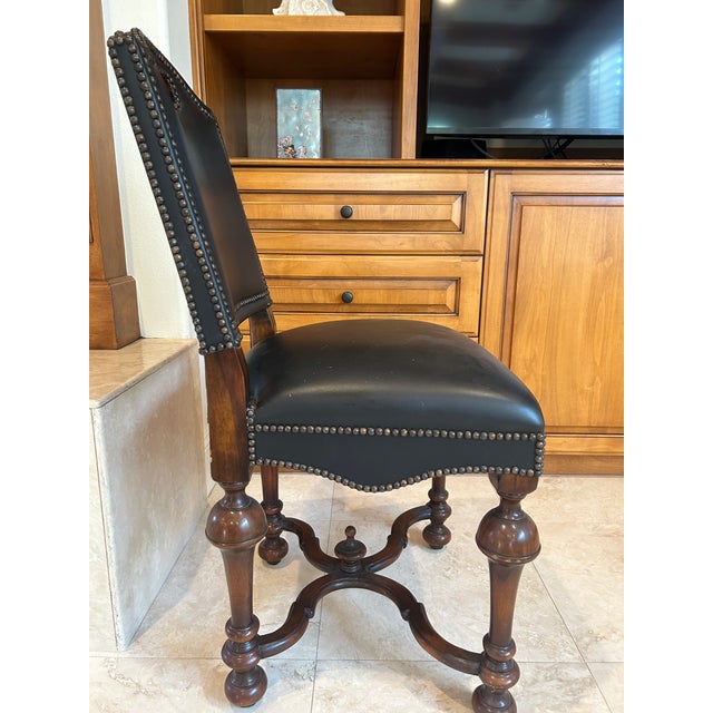 This refined Theodore Alexander Spanish Colonial–style side chair effortlessly blends old-world craftsmanship with...