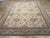 A wool pile with symmetric knots on a cotton foundation. This elegant workshop carpet showcases a cream field with a...
