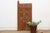 Attributed to the late 19th to early 20th century (circa 1890s–1920s), this authentic 67-inch architectural compound door...