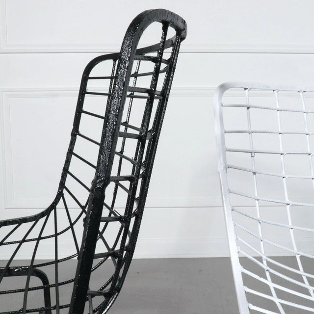 Set of 8 wire side chairs after Harry Bertoia for Knoll. Four in a white finish and four in a black finish. Some age...