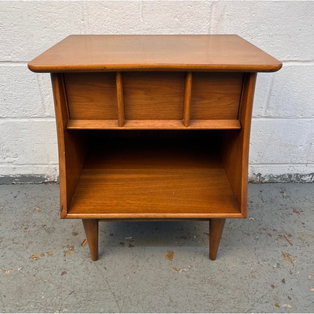 A timeless example of American mid-century modern design, this Kent Coffey "Eloquence" Nightstand showcases the elegant...