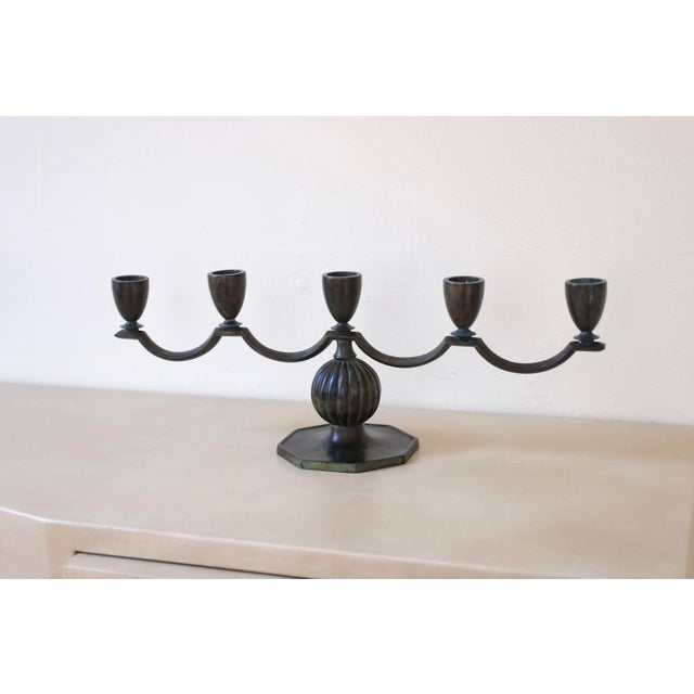 1930s bronze candleholder by GAB, Sweden, with space for 5 candles. Beautiful curvy shape with a nice green shade. Age...